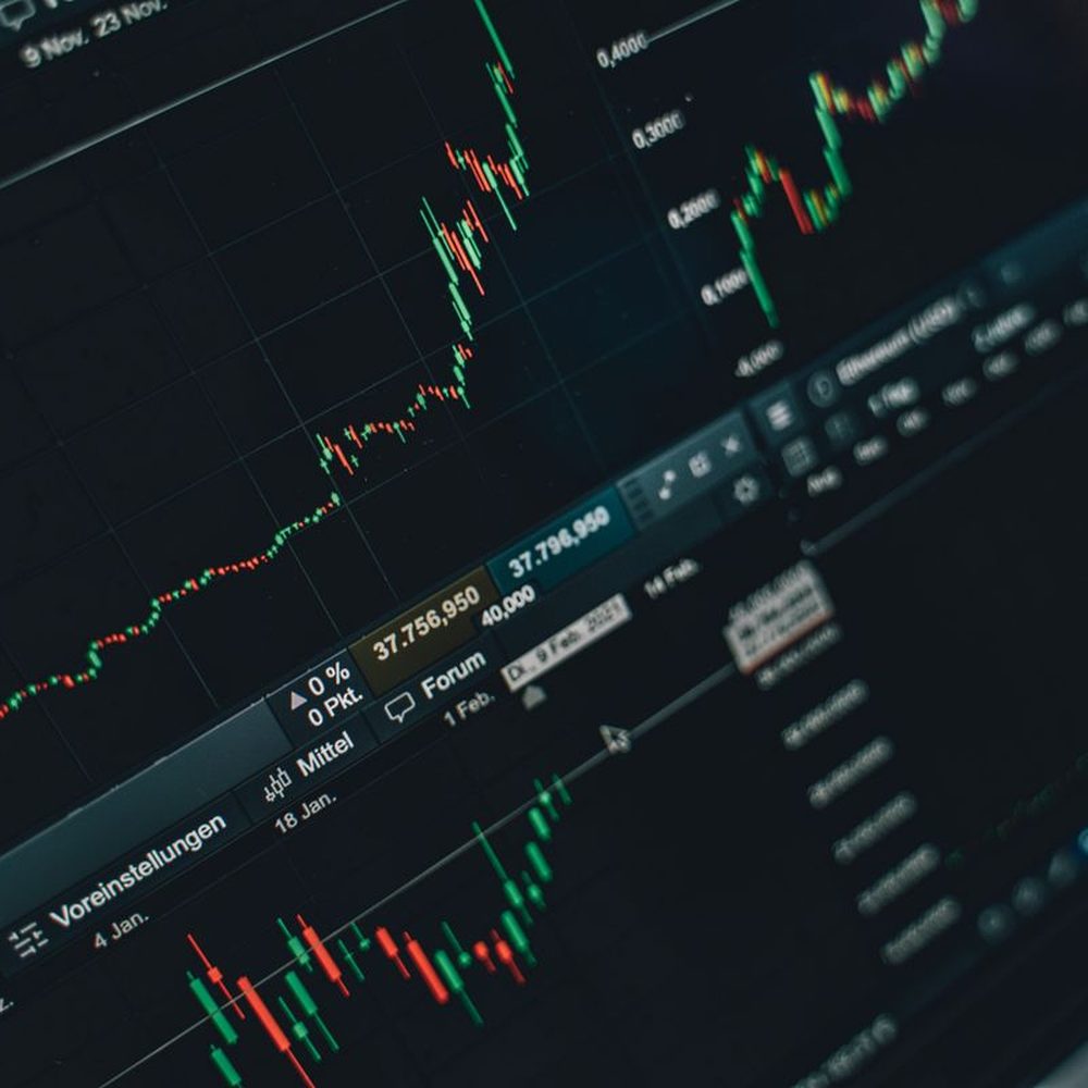Charts and data patterns displayed on a laptop screen