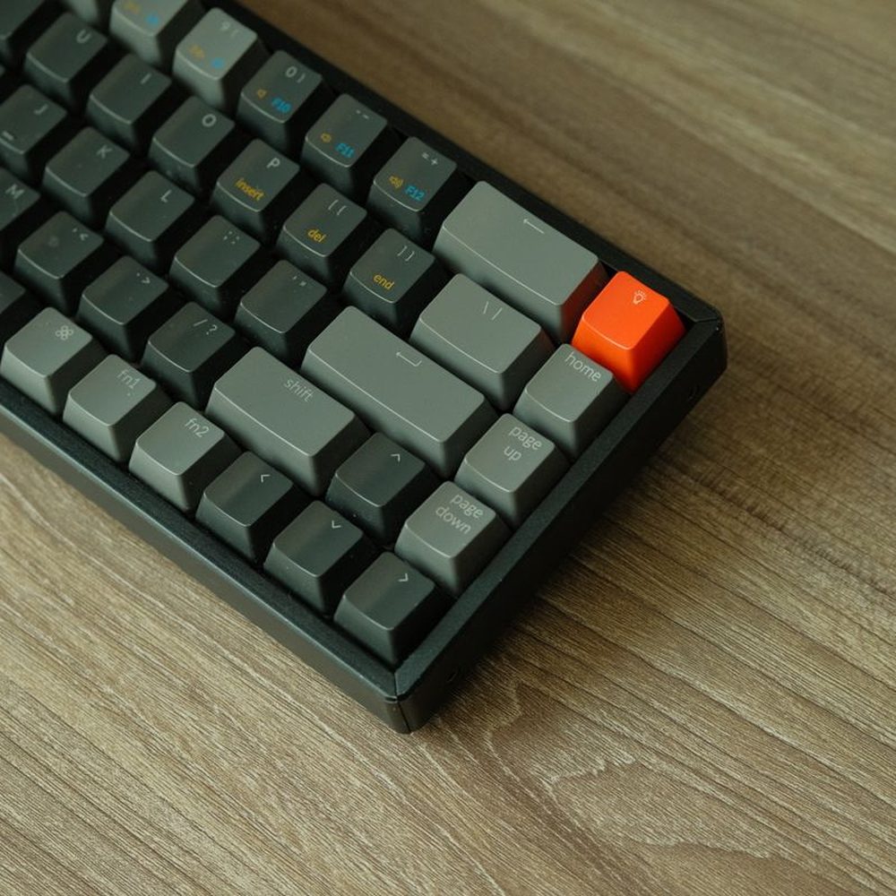 A mechanical keyboard on a wooden desk